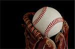 Close up of a baseball glove isolated on a black background