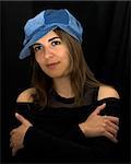 Beautiful woman portrait with a blue cap