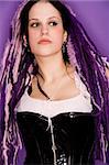 A beautifull girl with purple dreadlocks in her hair