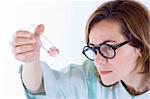 Scientist woman analyzing chemical material in test tube