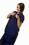Pretty young woman healthcare worker wearing blue scrubs with a friendly smile face pointing fingers forward