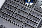 close up of silver mobile phone keyboard.