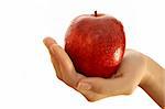 Red apple in a girl hand. Isolated over white