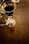 red wine glass isolated on wood background