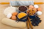 Baking time (flour, raw sugar, chocolate, blueberries, cinnamon sticks, vanilla beans, pecans and eggs)