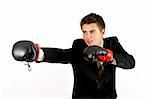 businessman over white boxing in suit with red gloves