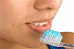 Close up of woman brushing her teeth