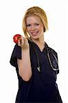 Young pretty woman healthcare worker wearing blue scrubs and a stethoscope holding a red apple in her hand standing on white