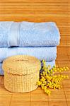 Bath accessories and beauty products on bamboo mat background. Shallow DOF