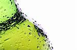 beer bottle abstract closeup, green wet bottle with water droplets, limited dof.
