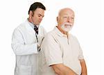 Doctor examining senior man.  Both have serious expressions.  Isolated on white.