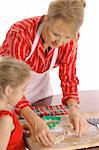 beautiful woman and child baking cookies