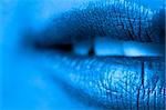 Macro blur image of bright lips -gold lipstik