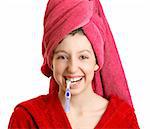 The girl in a red dressing gown cleans a teeth
