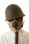 Person in gas mask and helmet on white background