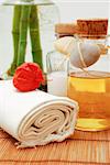 Bottle with aromatic oil or soap and towels - Accessories for wellness, spa or relaxing