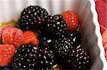 healthy white bowl of ripe fruit in syrup