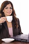 beautiful woman working on computer having tea