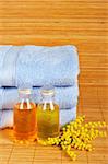 Bath accessories and beauty products on bamboo mat background. Shallow DOF