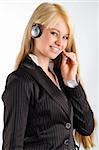 cute blond hostess chatting with earphone and smiling