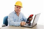 Confused electrician trying to fix a laptop computer using a voltage meter.  Isolated on white.