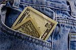 US currency in blue jeans pocket.