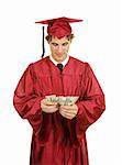 Handsome young graduate smiling and counting a stack of bills.  Isolated on white.