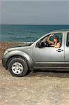 Woman and her 4wd car at Fuerteventura's beach