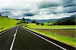 Road winding through farm land