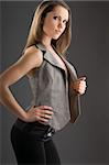 young and sensual woman with a waistcoat looking hard