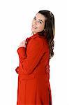 Beautiful fashion woman posing with a red coat isolated on white