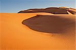 Erg Chebbi sand dunes on sunrise in the Sahara Desert near Hassi Labiad and Merzouga, Morocco. Algeria is located 20 km from here.