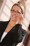 Good looking Caucasian business woman standing a front of the office