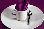 An elegant cafe table setting in purple
