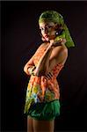 Portrait of young hispanic woman with colorful summer clothes - isolated on black