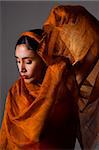 Portrait of hispanic dancer with orange veil