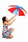 Portrait of a young happy woman posing with an umbrella (isolated on white)