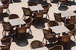 Many empty restaurant tables.