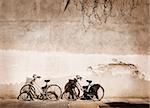 Italian old-style bicycles leaning against a wall in the historucal centre of Parma