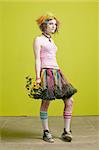 Pretty young woman with colorful punk clothes with plastic flowers.