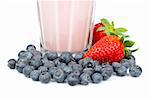 A fresh and nutritious strawberry milkshake with blueberries on white background. Shallow depth of field
