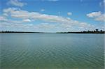 Summer lake reservoir, view from water dam