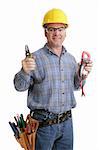 Electrician in safety goggles & hardhat holding up his wirestrippers and voltage meter.  Authentic and accurate content depiction - model is actual master electrician.