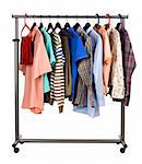 The multi-coloured  men's clothes hangs on a hanger on white  background