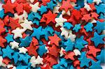 Confectionery ornament in the form of blue, red and white stars close up