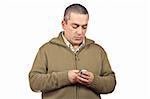 Casual man sending sms with cell phone over a white background