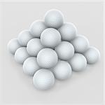golf ball pyramid stack on gray background
