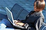 African american woman holding notebook in an office environment.