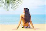 view of a young gorgeous female in tropical environment