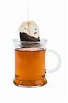 Cup of black tea with tea-bag on white background